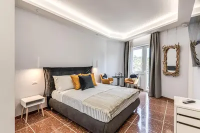 a bedroom with a large bed and a mirror at 3Storie Vatican St Peter in Rome