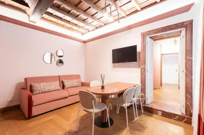 a living room with a couch and a table at My Trevi Suite & Apartment in Rome
