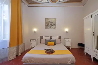 a bedroom with a large bed in a room at dolce casa colosseo 1 - 2 in Rome
