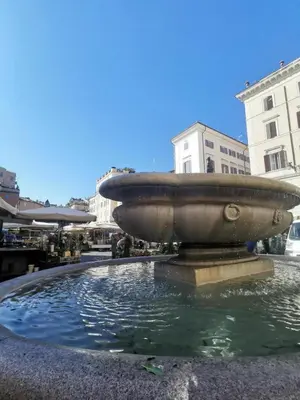 a fountain in the middle of a city at 