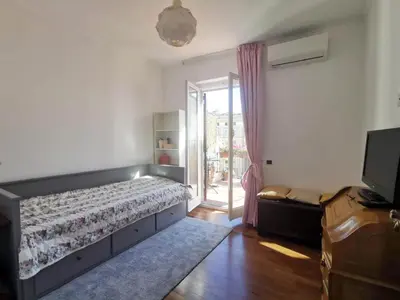 a bedroom with a bed and a sliding glass door at 