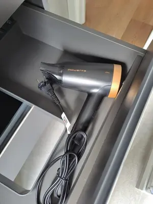 a hairdryer is sitting in a drawer at Simon's House in Rome