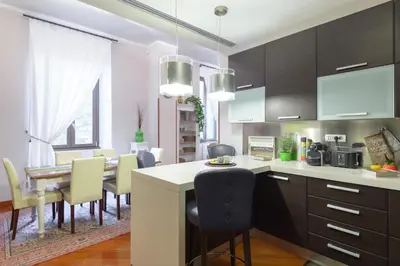 a kitchen and dining room with a table and chairs at Rome Guest House Saint Peter in Rome