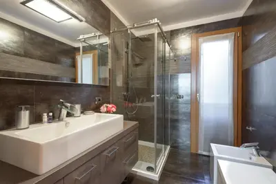 a bathroom with a sink and a shower at Rome Guest House Saint Peter in Rome