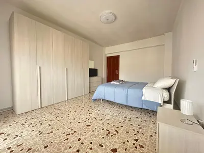 an apartment building with a balcony in a city at Holiday Roma prenestina in Rome