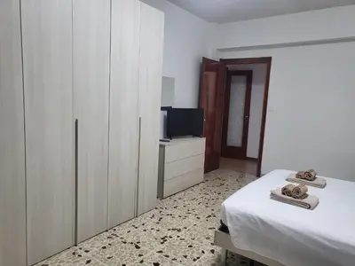 a living room with a couch and a marble floor at Holiday Roma prenestina in Rome