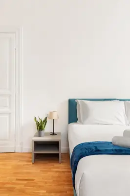 a bedroom with a bed and a side table at Rome Nice Stays in Rome