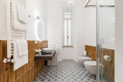 a bathroom with two toilets and a sink at Rome Nice Stays in Rome