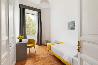 a bedroom with a bed and a desk and a window at Rome Nice Stays in Rome