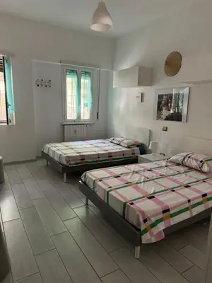 a room with two beds in a room at camera con bagno privato in Rome