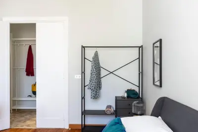 a bedroom with a bed and a mirror at Casa Fontanella by Hili in Rome
