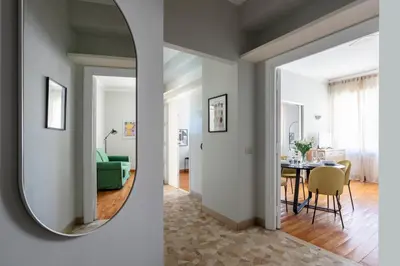 a room with a mirror and a dining room at Casa Fontanella by Hili in Rome