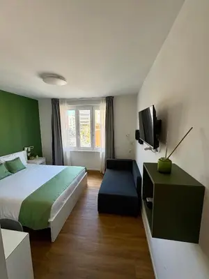 a room with a hallway with a mirror and a wall at Near Vatican, Irnerio 47 Guest House in Rome