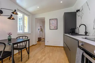 a kitchen with a table and a dining room at Domus Beato Angelico in Rome