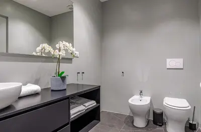 a bathroom with a white toilet and a sink at Domus Beato Angelico in Rome