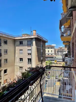 an apartment balcony with a view of a building at gt TRASTEVERE STATION HOUSE in Rome