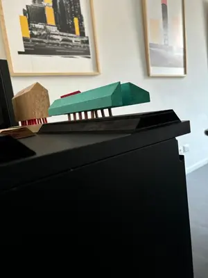 a black desk with a green box on top of it at Art Lab Residence in Rome