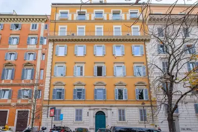 a large yellow building with a lot of windows at La Casa dei Sogni Roma in Rome