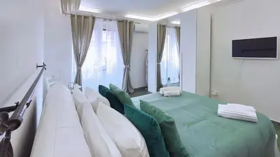 a hospital room with a bed and a tv at Sonia Monteverde Apartment per 4 in Rome