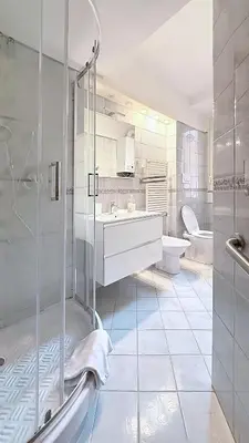 a bathroom with a shower and a sink and a toilet at Sonia Monteverde Apartment per 4 in Rome