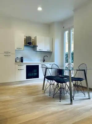 a dining room with a table and chairs in a kitchen at Al No60 in Rome