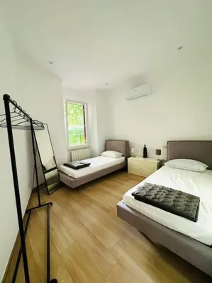 a room with two beds and a tripod in it at Al No60 in Rome