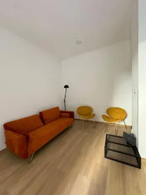 a living room with a couch and two chairs at Al No60 in Rome