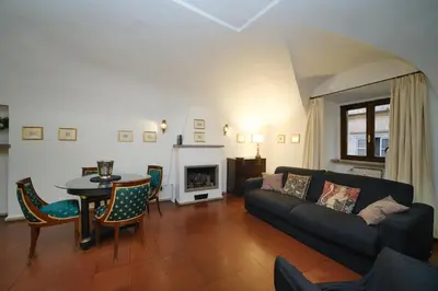 a living room with a couch and a table at Pantheon's Arch by BuddyRent in Rome