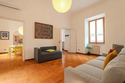 a living room with a couch and a table at Casa Lucrezio Saint Peter's in Rome