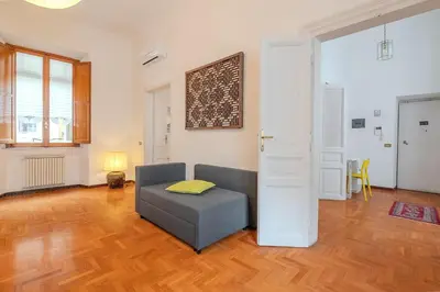 a living room with a couch and a chair at Casa Lucrezio Saint Peter's in Rome