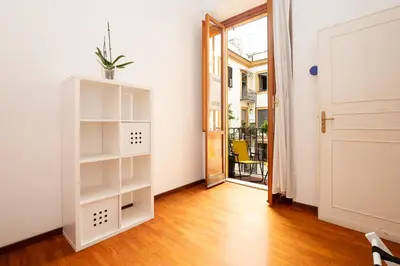 a room with a white book shelf and a door at Casa Lucrezio Saint Peter's in Rome