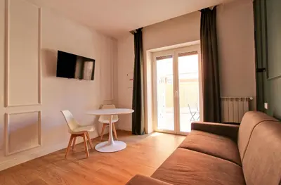 a living room with a couch and a table at Barigelli Apartment in Rome