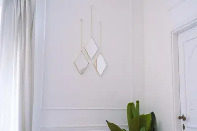 a light fixture hanging from a window in a room with a plant at Luxury Stay Piazza di Spagna in Rome