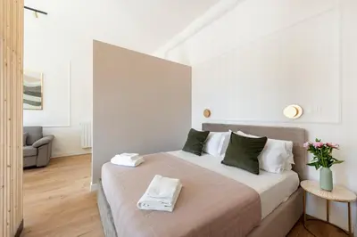 a bedroom with a bed in a room at White Flat 60 -San Lorenzo- in Rome