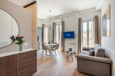 a living room with a couch and a table at White Flat 60 -San Lorenzo- in Rome