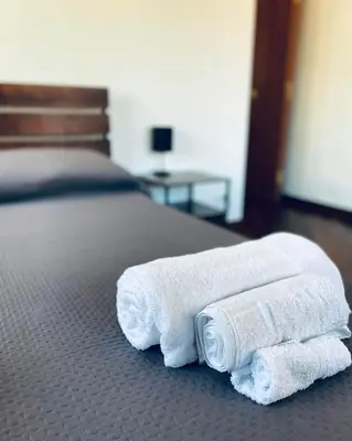 a couple of towels are sitting on a bed at Casa Giulia Monteverde in Rome