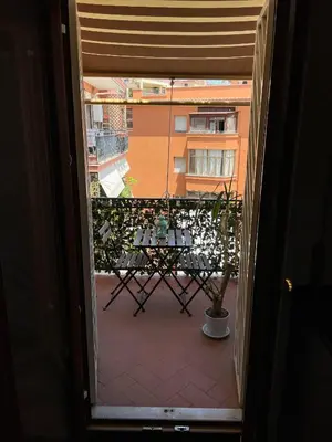 a view from a door of a balcony with a table at Casa Giulia Monteverde in Rome