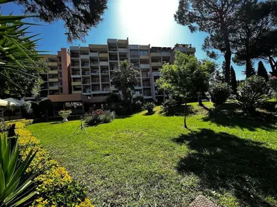 a large apartment building with a park in front of it at Monolocale Roma metro A Cornelia in Rome