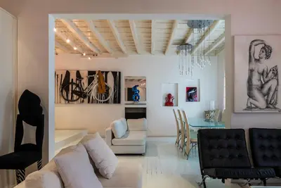 a living room with a couch and a table at Cappellari 4 - FromHometoRome in Rome