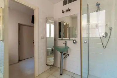 a bathroom with a glass shower and a toilet at Cappellari 4 - FromHometoRome in Rome