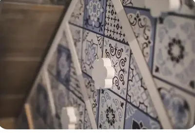 a blue and white patterned wall in a room at Green House in Rome