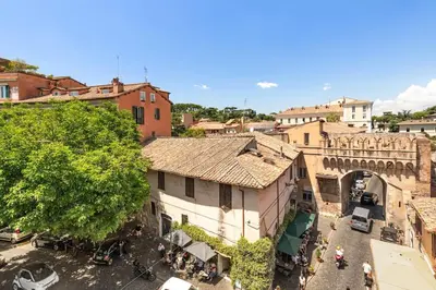 an aerial view of a town with a building at Casa Garibaldi, a Burghesius home in Rome