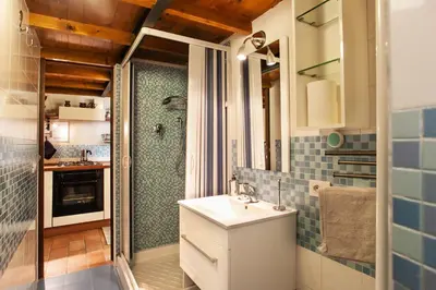 a small bathroom with a sink and a shower at Ninohouse in Rome