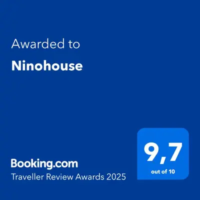 a blue phone screen with the text awarded to nitschoke at Ninohouse in Rome