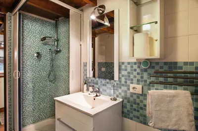 a bathroom with a sink and a shower at Ninohouse in Rome