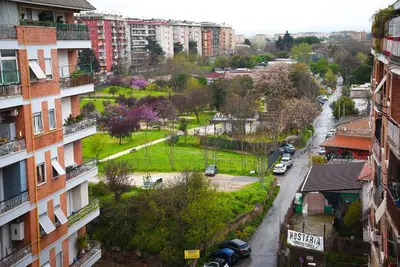 an aerial view of a city with buildings and a park at A Casa di Lilly in Rome