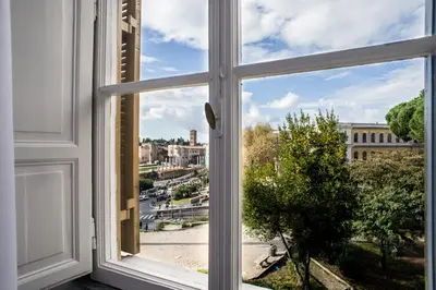 an open window with a view of a city at Romance al Colosseo in Rome