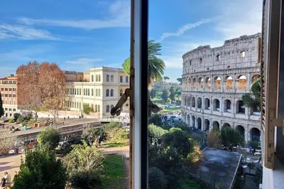 a window with a view of the coliseum at Romance al Colosseo in Rome