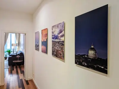 a group of pictures hanging on a wall in a room at Luxury Gallery Suites in Rome