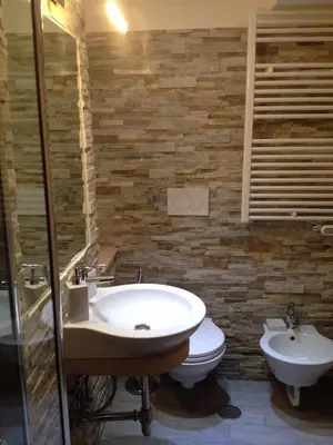 a bathroom with a sink and a toilet at HomeFlat in Rome